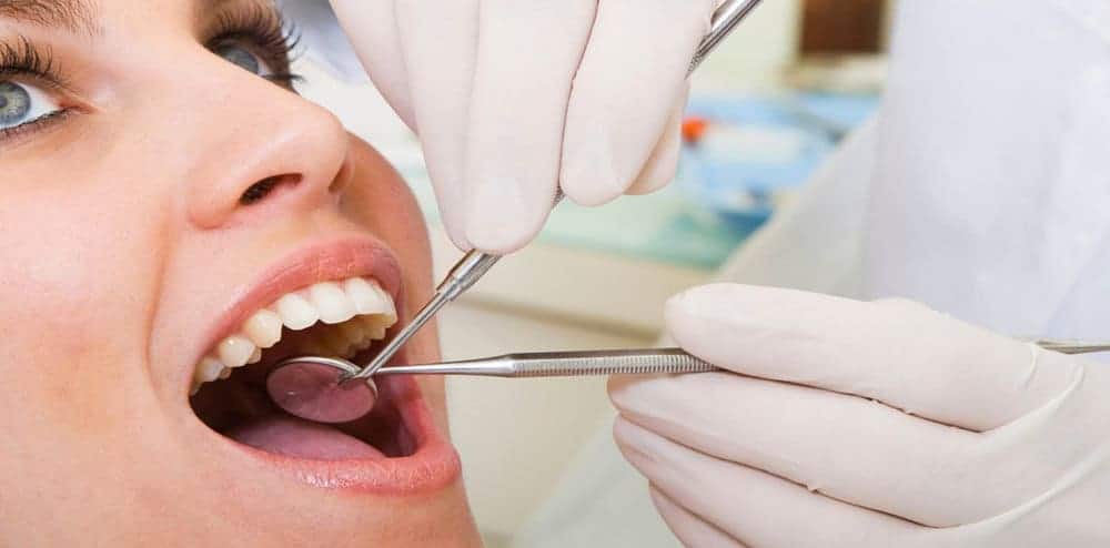 Woman getting a dental exam