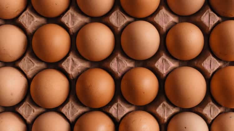 Aerial view of a carton of brown eggs that promote strong teeth because they are rich in vitamin D